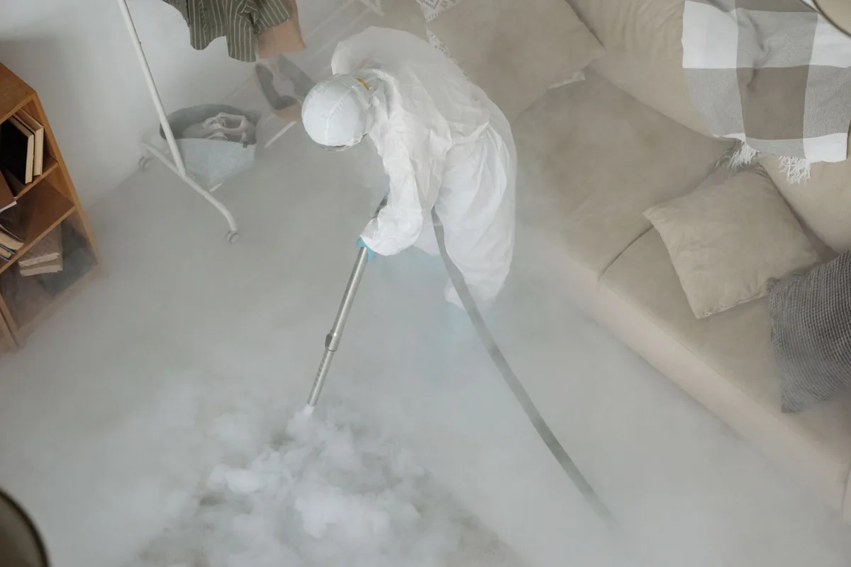 Biohazard cleanup technician in protective equipment, Philpot, KY